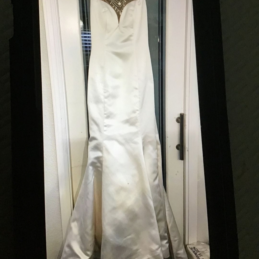 Brand new… Never worn or altered.  Gorgeous Sherry Hill dress size 6